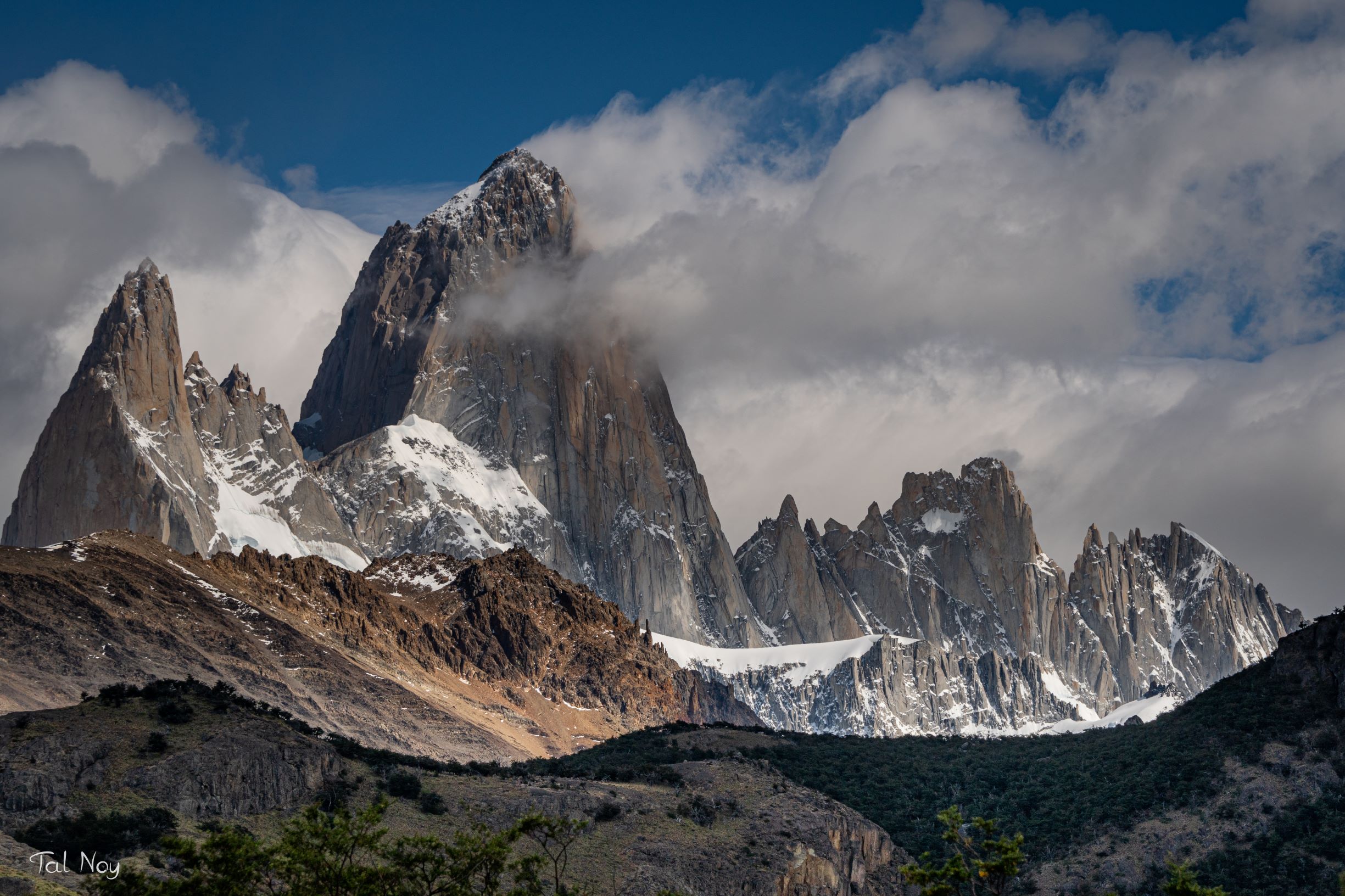 Mount Fitz Roy and its surrounding peaks with clouds emerging from the summit, El Chalten, Argentina